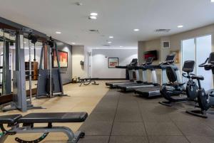 a gym with rows of treadmills and exercise bikes at DoubleTree by Hilton Hotel Savannah Airport in Savannah