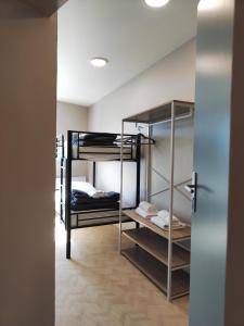 a hallway with bunk beds in a room at Hotel de la Terrasse in Berck-sur-Mer