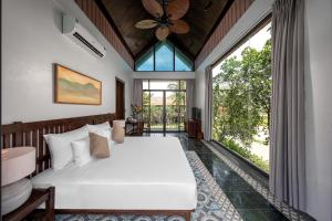 Ein Bett oder Betten in einem Zimmer der Unterkunft Coco Island Resort Ninh Binh