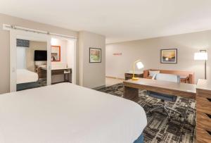 a hotel room with a bed and a desk at Hampton Inn & Suites Benton Harbor, MI in Benton Harbor