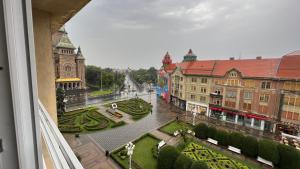 a view from a balcony of a town with a fountain at MarioApartCentralView in Timişoara