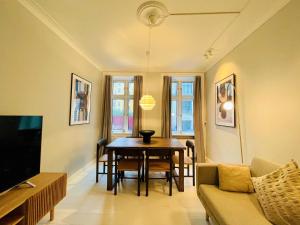 a living room with a table and a couch at Amazing Apartment in Urban Neighborhood in Copenhagen