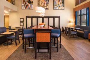 a waiting room with a table and chairs at Hampton Inn and Suites Schertz in Schertz