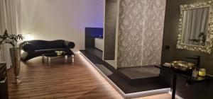 Area soggiorno di Privat-Spa mit Whirlpool und Sauna in Sursee
