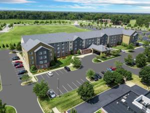 an aerial view of a building with a parking lot at Homewood Suites by Hilton Louisville-East in Louisville