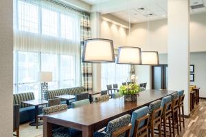 a conference room with a wooden table and chairs at Hampton Inn & Suites by Hilton Seattle/Northgate in Seattle +36 photos