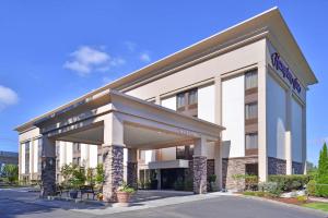 a rendering of the front of a hotel at Hampton Inn Seattle Airport in SeaTac