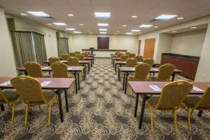 a conference room with tables and chairs and a podium at Hampton Inn & Suites Berkshires-Lenox in Lenox +34 photos