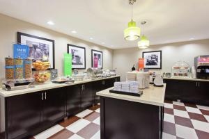 a fast food restaurant with a counter with food at Hampton Inn Morgan Hill in Morgan Hill