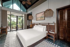 Ein Bett oder Betten in einem Zimmer der Unterkunft Coco Island Resort Ninh Binh