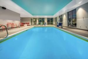 a large swimming pool in a hotel room at Tru By Hilton Salt Lake City Midvale in Midvale
