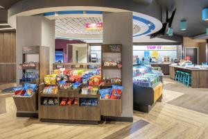 a store with a display of chips and other snacks at Tru By Hilton Salt Lake City Midvale in Midvale