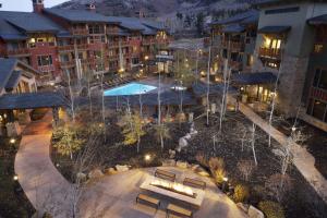 an aerial view of a resort with a pool at night at Hilton Grand Vacations Club Sunrise Lodge Park City in Park City