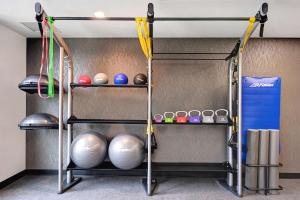 a shelf with balls and other items on it at Home2 Suites By Hilton Anaheim Resort in Anaheim