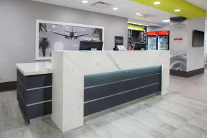 a lobby of a store with a reception desk at Hampton Inn & Suites Irvine/Orange County Airport in Irvine