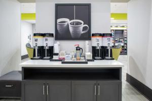 a counter in a store with coffee equipment on it at Hampton Inn & Suites Irvine/Orange County Airport in Irvine
