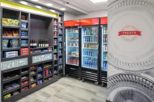 a grocery store aisle with shelves of food at Hampton Inn & Suites Irvine/Orange County Airport in Irvine
