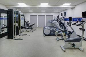 a gym with several treadmills and cardio machines at Hampton Inn & Suites Irvine/Orange County Airport in Irvine