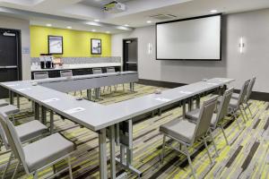 a conference room with a large table and chairs at Hampton Inn & Suites Irvine/Orange County Airport in Irvine