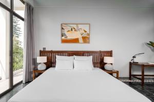 Ein Bett oder Betten in einem Zimmer der Unterkunft Coco Island Resort Ninh Binh
