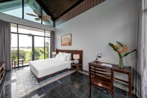 Ein Bett oder Betten in einem Zimmer der Unterkunft Coco Island Resort Ninh Binh