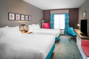 מיטה או מיטות בחדר ב-Hilton Garden Inn Brunswick