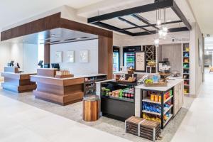 a grocery store with a counter with food on it at Hilton Garden Inn Brunswick in Brunswick