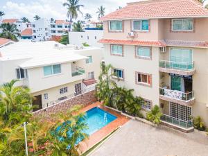 an aerial view of a building with a swimming pool at Hotel Las Rosas de Punta Cana in Punta Cana
