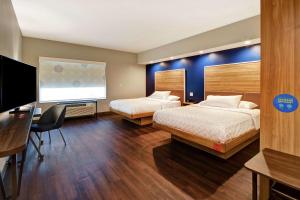 Postel nebo postele na pokoji v ubytování Tru By Hilton Syracuse-Camillus