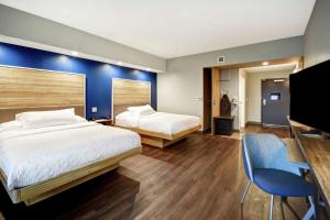 Postel nebo postele na pokoji v ubytování Tru By Hilton Syracuse-Camillus + 16 fotografií