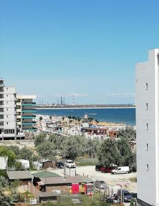 a view of a city and the ocean from a building at Lora Studio in Mamaia Nord