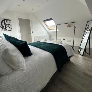 a bedroom with a large bed and a ladder at Entire home in Nottingham in Nottingham