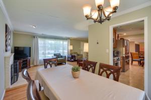 a dining room and living room with a table and chairs at Campbell Vacation Rental about 8 Mi to San Jose! in Campbell