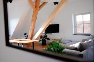 a living room with a couch and a table at Trautesheim Ferienwohnungen in Wangen im Allgäu