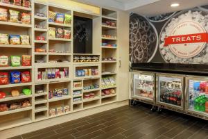 a grocery store aisle with shelves of food at Hampton Inn & Suites Tallahassee I-10-Thomasville Road in Tallahassee