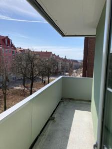 a balcony with a view of a city at Majorstua, charming and modern 2 bedroom apartment in Oslo