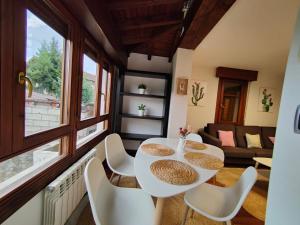 a room with a table and chairs and a couch at Casa in Artea