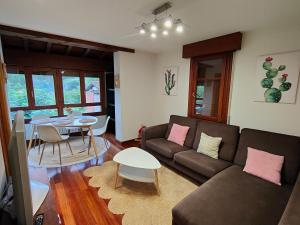 a living room with a couch and a table at Casa in Artea