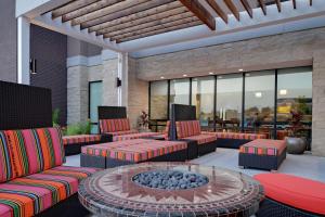 a patio with couches and a fire pit at Home2 Suites By Hilton Temple in Temple