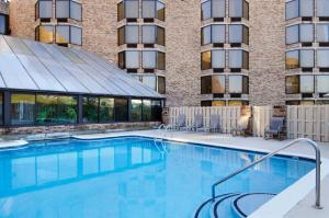 a large swimming pool in front of a building at DoubleTree by Hilton Johnson City in Johnson City
