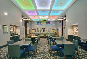 a dining room with tables and chairs and a cafeteria at Homewood Suites by Hilton Hamilton, NJ in Hamilton