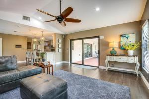 a living room with a couch and a ceiling fan at Coral Springs Home with Proximity to Golf and Beaches! in Coral Springs