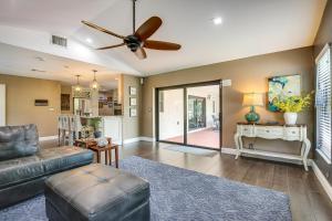a living room with a couch and a ceiling fan at Near Golf and Beaches Coral Springs Home with Yard! in Coral Springs
