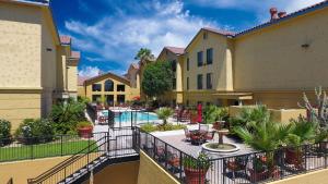 a view of a courtyard of a building with a pool at Hampton Inn & Suites Tucson Mall in Tucson