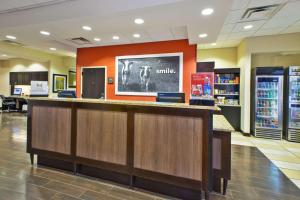 a bar in a store with a sign on the wall at Hampton Inn Washington-Dulles International Airport South in Chantilly