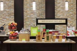 a counter with apples and other food items on it at Hampton Inn Washington-Dulles International Airport South in Chantilly
