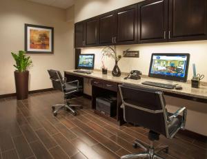 an office with two computers on a desk with chairs at Hampton Inn Washington-Dulles International Airport South in Chantilly
