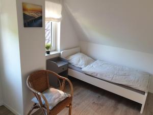 Postel nebo postele na pokoji v ubytování **Ferienhaus Kehrwieder** nahe der OSTSEE