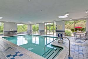 a large swimming pool with blue water at Hampton Inn & Suites Leesburg in Leesburg