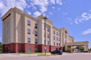 a building with a car parked in front of it at Hampton Inn & Suites Woodward in Woodward